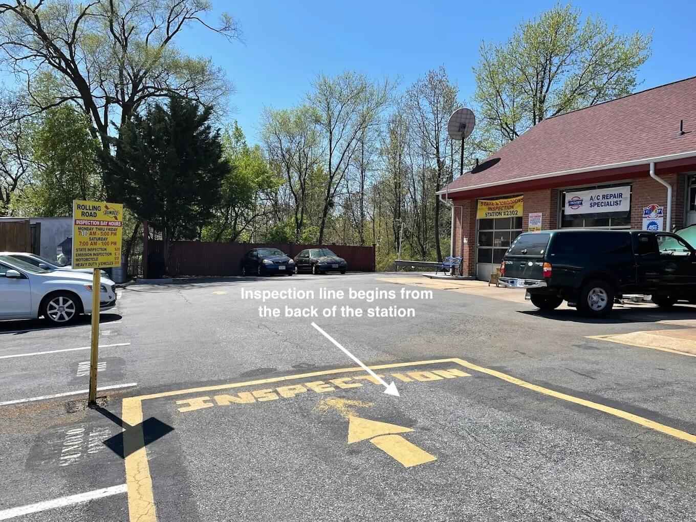 Inspection line at Rolling Road Sunoco Automotive — begins from the back of the station